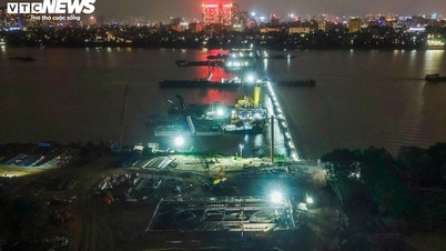 Der Bau der Tran Hung Dao Brücke über den Roten Fluss wird Tag und Nacht fortgesetzt und schreitet zügig voran, um im Jahr 2027 abgeschlossen zu werden.