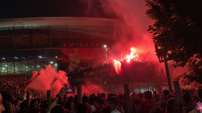 Arsenal fans celebrated wildly, setting off flares around the Emirates Stadium.
