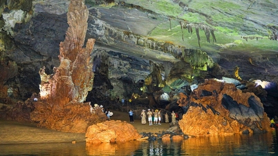 Tourists flock upstream on the Son River to Phong Nha Cave amidst the peak of the hot season.