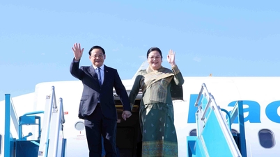 Laos' premierminister og hans kone indleder deres besøg i Vietnam.