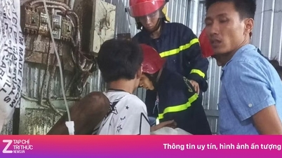 Young man's arm trapped in plastic recycling machine.