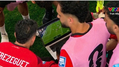 Bizarre: Egyptians open their laptops to watch goalkeeper Ryan save penalties, leaving Australia speechless.